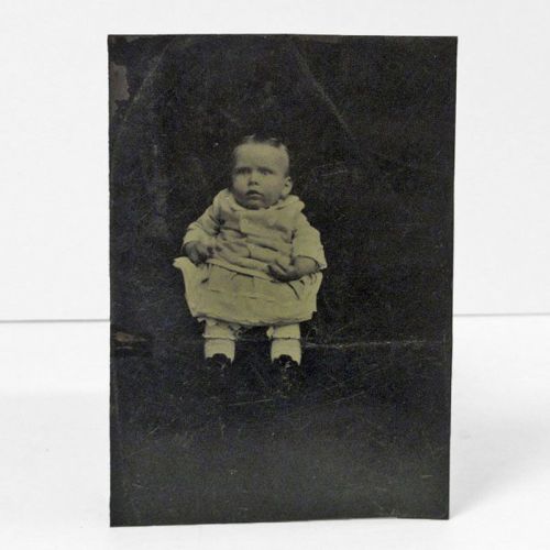 Antique Tintype Photo: Scared baby with her mother holding her, hidden out of sight under some sort of dark cloth: Front View
