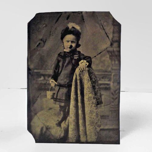 Antique Tintype Photo: Little girl standing sideways on a chair holding a basket: Front View