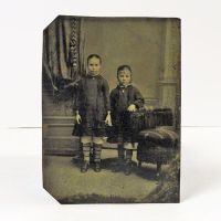 Antique Tintype Photo: Two girls, wearing matching socks, standing holding hands: Front View - Click to enlarge