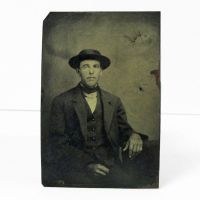 Antique Tintype Photo: Man sitting, wearing a button down vest with jacket and a flat hat and pinkie ring: Front View - Click to enlarge