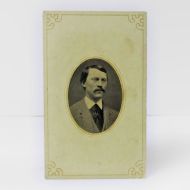 Antique Tintype Photo: well dressed man from the shoulder area up sporting a full mustache placed in a card frame: Front View