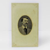 Antique Tintype Photo: well dressed man from the shoulder area up sporting a full mustache placed in a card frame: Front View - Click to enlarge