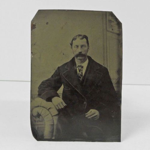 Antique Tintype Photo: Man sporting a mustache that looks like a hairy caterpillar. Heavy coat and argyle tie: Front View