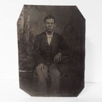 Antique Tintype Photo: Man wearing a button down vest with jacket sitting hand on leg with his fingers spread apart: Front View - Click to enlarge