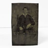 Antique Tintype Photo: Man sitting, wearing a watch chain and jacket with the top button fastened: Front View