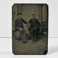 Antique Tintype Photo: Two men sitting, one man wearing his bowler hat, the other man holding his similar hat on his lap: Front View - Click to enlarge