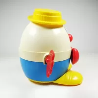 Vintage Fisher Price Humpty Dumpty pull toy with original yellow pull wire. Red hands spin when toy is pulled: Right - Click to enlarge