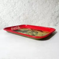 Vintage 1987 Coca Cola metal tray wall hanging shows a blacksmith and boy drinking coke from a bottle: Right Side View - Click to enlarge