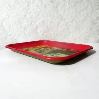 Vintage 1987 Coca Cola metal tray wall hanging shows a blacksmith and boy drinking coke from a bottle: Left Side View - Click to enlarge