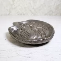 Naughty double sided cast metal waitress tip tray or germaphobic handshake tray. Military man grabs woman's butt: Lower Edge - Click to enlarge