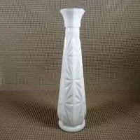 Vintage milk glass bud vase with fluted octagon top and diamond starburst design: Front - Click to enlarge