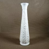 Vintage milk glass bud vase with fluted octagon top and diamond starburst design: Back - Click to enlarge